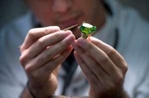 A jeweler works on a piece of the French